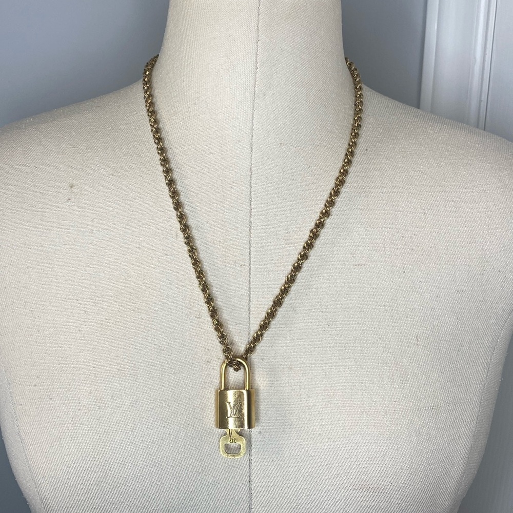 Authentic Louis Vuitton Lock & key # 312 on a Antique Gold Tone Necklace